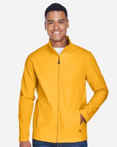 Team 365 TT80 Men’s Leader Soft Shell Jacket – Sport Athletic Gold (on model)