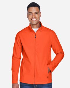 Team 365 TT80 Men’s Leader Soft Shell Jacket – Sport Orange (on model)