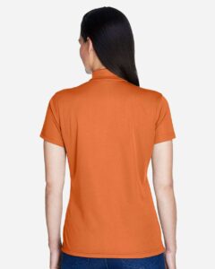 Team 365 TT21W Women’s Command Snag Protection Polo – Sport Burnt Orange (on model back)