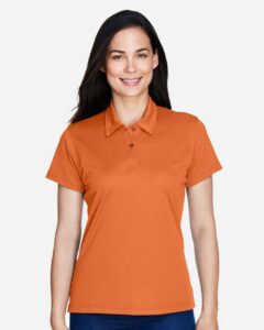 Team 365 TT21W Women’s Command Snag Protection Polo – Sport Burnt Orange (on model)