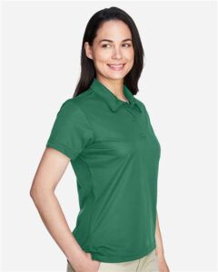 Team 365 TT21W Women’s Command Snag Protection Polo – Sport Dark Green (on model side)