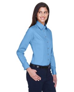 Harriton M500W Women’s Easy Blend™ Twill Dress Shirt with Stain-Release – Light College Blue (on model side)