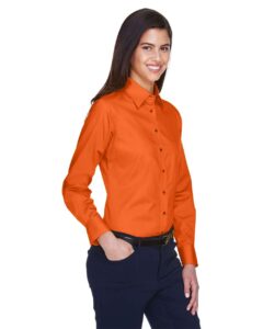 Harriton M500W Women’s Easy Blend™ Twill Dress Shirt with Stain-Release – Team Orange (on model side)