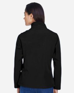 Team 365 TT80W Women’s Leader Soft Shell Jacket – Black (on model back)