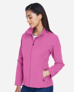 Team 365 TT80W Women’s Leader Soft Shell Jacket – Sport Charity Pink (on model side)