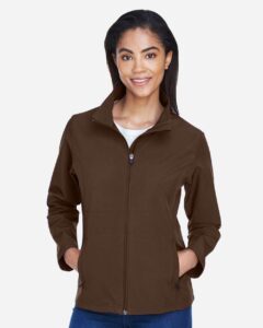 Team 365 TT80W Women’s Leader Soft Shell Jacket – Sport Dark Brown (on model)