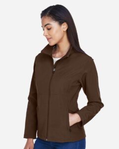 Team 365 TT80W Women’s Leader Soft Shell Jacket – Sport Dark Brown (on model side)