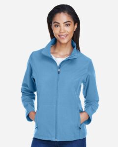 Team 365 TT80W Women’s Leader Soft Shell Jacket – Sport Light Blue (on model)