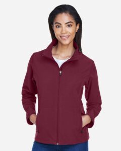 Team 365 TT80W Women’s Leader Soft Shell Jacket – Sport Maroon (on model)