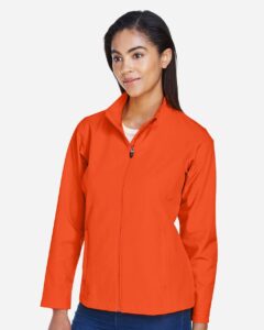 Team 365 TT80W Women’s Leader Soft Shell Jacket – Sport Orange (on model side)