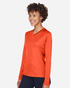 Team 365 TT11WL Women’s Zone Performance Long Sleeve T-Shirt – Sport Orange (on model side)