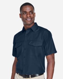 Harriton M580 Men’s Key West Short Sleeve Performance Staff Shirt – Navy (on model side)
