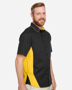 Harriton M586 Men’s Flash IL Colorblock Shirt – Black/ Sunray Yellow (on model side)