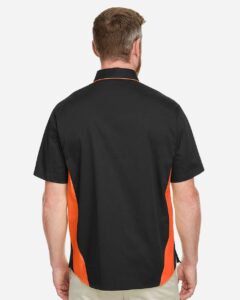 Harriton M586 Men’s Flash IL Colorblock Shirt – Black/ Team Orange (on model back)