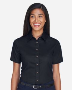 Harriton M500SW Women’s Easy Blend™ Short Sleeve Twill Dress Shirt with Stain-Release – Black (on model)