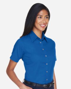 Harriton M500SW Women’s Easy Blend™ Short Sleeve Twill Dress Shirt with Stain-Release – French Blue (on model side)