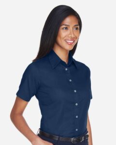Harriton M500SW Women’s Easy Blend™ Short Sleeve Twill Dress Shirt with Stain-Release – Navy (on model side)