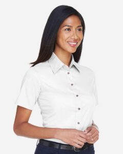 Harriton M500SW Women’s Easy Blend™ Short Sleeve Twill Dress Shirt with Stain-Release – White (on model side)