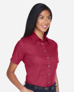 Harriton M500SW Women’s Easy Blend™ Short Sleeve Twill Dress Shirt with Stain-Release – Wine (on model side)