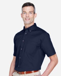 Harriton M500S Men’s Easy Blend™ Twill Dress Shirt with Stain-Release – Navy (on model side)