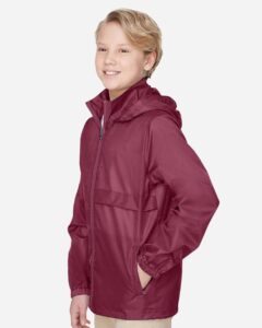 Team 365 TT73Y Youth Zone Protect Lightweight Jacket – Sport Maroon (on model side)