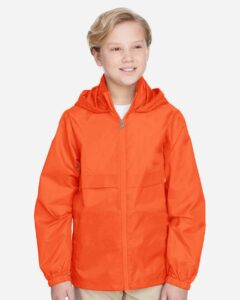Team 365 TT73Y Youth Zone Protect Lightweight Jacket – Sport Orange (on model)