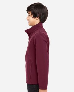 Team 365 TT80Y Youth Leader Soft Shell Jacket – Sport Maroon (on model side)