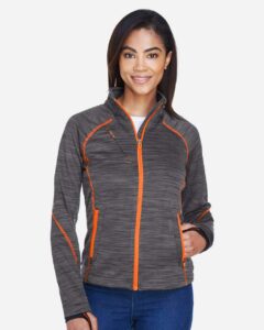 North End 78697 Women’s Flux Mélange Bonded Fleece Jacket – Carbon/ Orange Soda (on model)