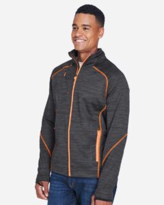 North End 88697 Men’s Flux Mélange Bonded Fleece Jacket – Carbon/ Orange Soda (on model side)
