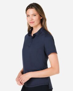 North End NE110W Women’s Revive Coolcore® Polo – Classic Navy (on model side)