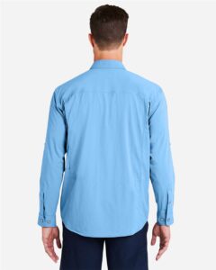 HUK H150184 Men’s Creekbed Pocket Fishing Shirt – Marolina Blue (on model back)