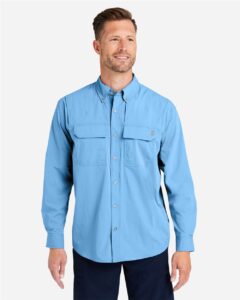 HUK H150184 Men’s Creekbed Pocket Fishing Shirt – Marolina Blue (on model)