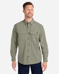 HUK H150184 Men’s Creekbed Pocket Fishing Shirt – Moss (on model)
