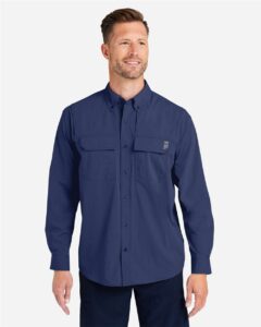 HUK H150184 Men’s Creekbed Pocket Fishing Shirt – Naval Academy (on model)