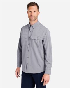 HUK H150184 Men’s Creekbed Pocket Fishing Shirt – Night Owl (on model side)