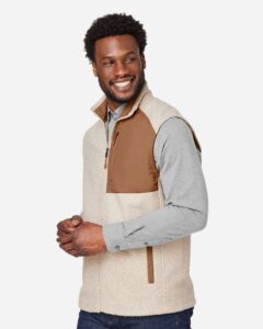 North End NE714 Men’s Aura Sweater Fleece Vest – Oatmeal Heather/ Teak (on model side)
