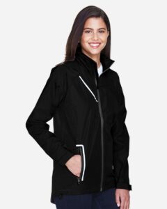 Team 365 TT86W Women’s Dominator Waterproof Jacket – Black (on model side)