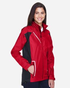 Team 365 TT86W Women’s Dominator Waterproof Jacket – Sport Red (on model side)