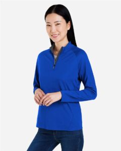 CORE365 CE418W Women’s Origin Performance Pique Quarter-Zip Pullover – True Royal/ Carbon (on model side)