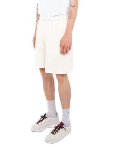 Shaka Wear SHGFS Unisex Garment-Dyed Shorts – Cream (on model side)