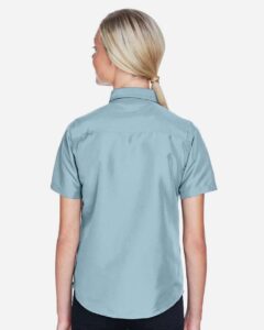 Harriton M580W Women’s Key West Short Sleeve Performance Staff Shirt – Cloud Blue (on model back)