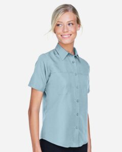 Harriton M580W Women’s Key West Short Sleeve Performance Staff Shirt – Cloud Blue (on model side)