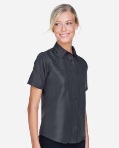 Harriton M580W Women’s Key West Short Sleeve Performance Staff Shirt – Dark Charcoal (on model side)
