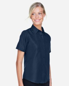 Harriton M580W Women’s Key West Short Sleeve Performance Staff Shirt – Navy (on model side)