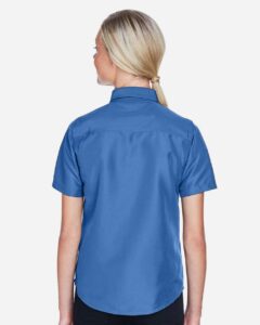Harriton M580W Women’s Key West Short Sleeve Performance Staff Shirt – Pool Blue (on model back)
