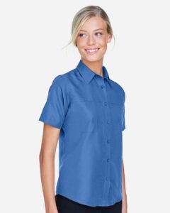 Harriton M580W Women’s Key West Short Sleeve Performance Staff Shirt – Pool Blue (on model side)