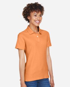 Devon & Jones DG150W Women’s DRYTEC20™ Performance Polo – Cantaloupe (on model side)