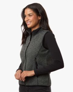 North End NE731W Women’s Jasper Jacquard Fleece Vest – Black/ Grey (on model side)