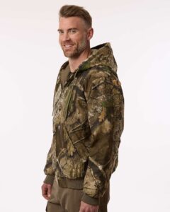 Berne Apparel HJ51 Men’s Berne Heritage Hooded Jacket – Realtree Apx (on model side)
