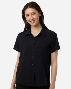 CORE365 CE520W Women’s UltraUVP Shoreline Short Sleeve Staff Shirt – Black (on model)